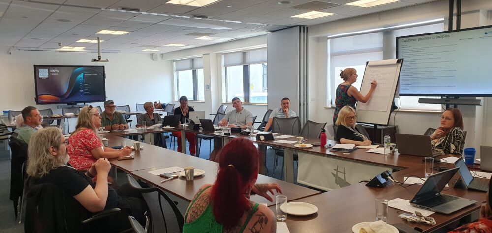 Residents and staff discussing our commitments