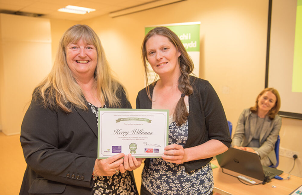 Julie James AM with a Melin resident