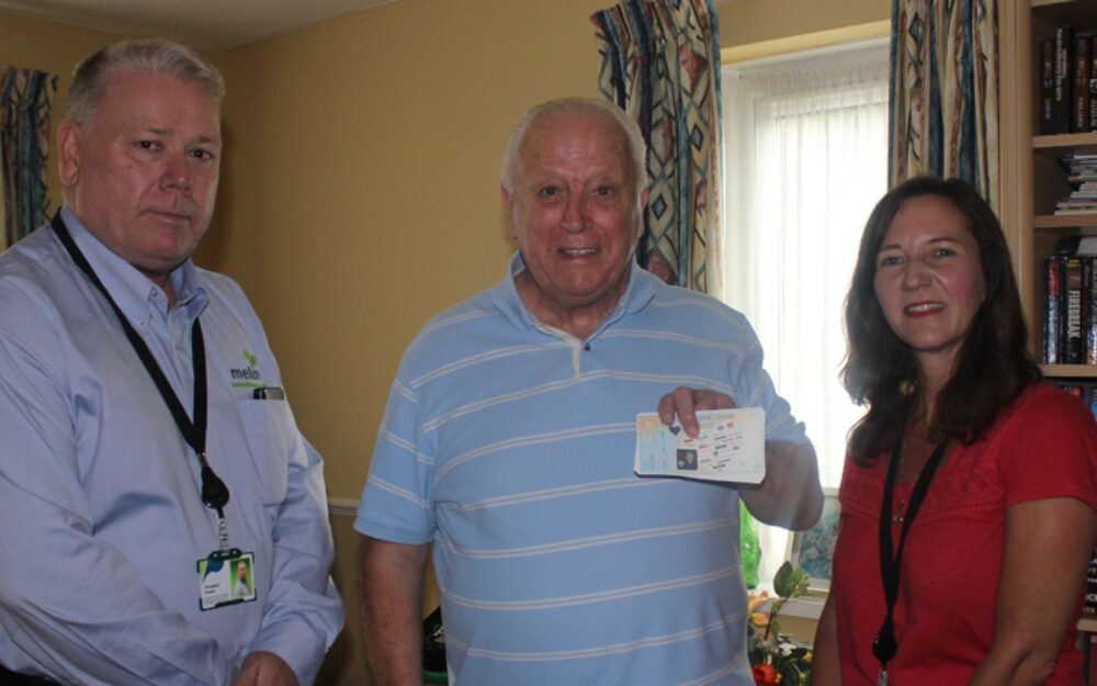 John Sexton receives his vouchers