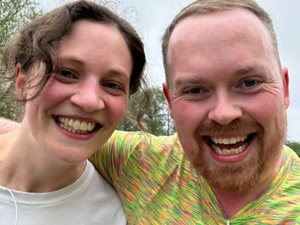 A picture of staff member Will with his wife on a run