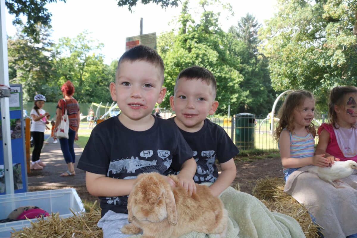 Visitors enjoying the animals from Greenmeadow Community Farm