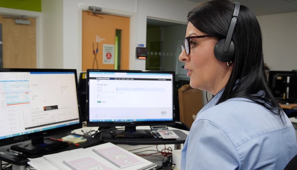 A Melin staff member on the phone sat at her desk